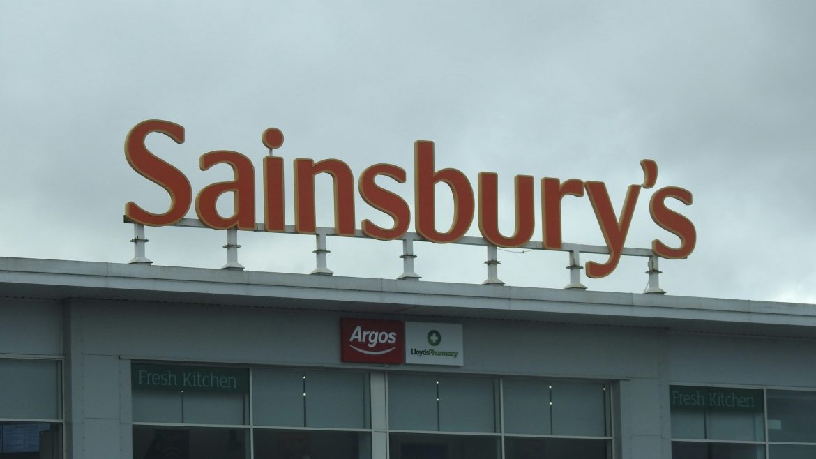 Shares in J Sainsbury PLC surged on Thursday, closing up 4% at 257.8p, making it the top performer on the FTSE 100 index. The rally came after the British supermarket giant reported its full-year financial results, which showed a 7.2% rise in retail underlying operating profit to £1.04 billion for the 2024/25 fiscal year. The result marks the first time Sainsbury’s has posted over £1 billion in annual operating profits, excluding one-off items.The rebound in share price also marks a full recovery from last month’s slump, when Asda’s announcement of price cuts triggered a sell-off across the UK grocery sector. Sainsbury’s stock, which had fallen as low as 223p during the broader market sell-off tied to political uncertainty in the United States, is now trading above the levels seen before Asda’s move.The results appear to validate Sainsbury’s focus on core food retail operations, which performed well amid a difficult trading environment marked by rising costs and heightened price sensitivity among consumers.Profit milestone reached, but outlook remains conservativeWhile Sainsbury’s reported a 38.6% jump in pre-tax profits to £384 million, this figure was supported by a strong performance in its food business and adjusted to exclude one-time restructuring costs, including the closure of in-store cafes and hot food counters.Chief executive Simon Roberts credited the company’s progress to consistent investment in price, product quality, and customer service. “We’ve delivered a strong set of results by staying true to our strategy of giving customers what they want: great value, quality and service,” he said.Despite the record-breaking performance, the company struck a cautious note for the year ahead. It forecast retail underlying operating profit of around £1 billion for the 2025/26 financial year, below analysts’ expectations of £1.08 billion. The guidance reflects concerns about persistent inflation, higher labour and supply chain costs, and the intensifying competition in the UK supermarket sector.Analysts find guidance “subdued” but foresee room for upside if market stabilises While the market welcomed the past year’s strong performance, analysts offered mixed views on the outlook. Shore Capital analysts Clive Black and Darren Shirley noted that Sainsbury’s is in a solid operational position and plans to increase market share in food retailing. However, they acknowledged that the subdued guidance reflects a prudent approach amid a shifting competitive landscape.“The guidance shows determination to defend value credentials following Asda’s aggressive strategy,” they wrote in a note to clients. “It may be conservative, but leaves room for upside if market dynamics stabilise.”RBC Capital Markets analysts Manjari Dhar and Richard Chamberlain said the lower-than-expected guidance was disappointing given Sainsbury’s strong prior performance and <a href="https://invezz.com/news/2025/04/10/tesco-sainsburys-miss-out-on-ftse-rally-amid-pricing-pressure/">recent commentary from Tesco</a> that signalled higher competitiveness across the board.“With the sector about to be embroiled in a trade war of its own, Sainsbury is preparing for the fight with some added momentum which should provide some protection,” said Richard Hunter, head of markets at Interactive Investor.Outlook to help Sainsbury’s manoeuvre stiff competition The UK’s supermarket sector has entered a <a href="https://invezz.com/news/2025/04/10/tesco-sainsburys-miss-out-on-ftse-rally-amid-pricing-pressure/">phase of heightened competition</a>, with price cuts emerging as a key weapon in the battle for market share. Asda’s decision to slash prices sent a ripple effect across the industry, forcing peers like Sainsbury’s, Tesco, and Marks & Spencer to react. Analysts believe the outlook from Sainsbury’s is deliberately cautious, allowing room to manoeuvre should conditions worsen.Hargreaves Lansdown’s Aarin Chiekrie described the guidance as “conservative,” roughly 8% below consensus, and said it mirrors Tesco’s approach in offering flexibility during a volatile period.“But shy of an all-out price war, there could be room for positive surprises as the year progresses,” he added.Despite near-term uncertainty, investor sentiment towards Sainsbury’s remains relatively positive. According to LSEG data, eight out of thirteen analysts rate the stock a “buy” or “higher,” while the median price target stands at 300p—implying further upside potential.As Sainsbury’s prepares for a potentially difficult year ahead, it appears to be entering the fray with both momentum and caution.The post <a href="https://invezz.com/news/2025/04/17/sainsburys-shares-rise-as-profit-tops-1bn-analysts-flag-cautious-guidance-amid-price-war-risks/">Sainsbury’s shares rise as profit tops £1bn; analysts flag cautious guidance amid price war risks</a> appeared first on <a href="https://invezz.com/">Invezz</a>